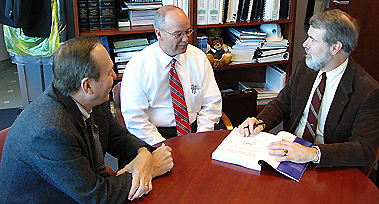 (l-r:) Moe Quirin, former Manchester Airport director Kevin Dillon, Ed Brouder