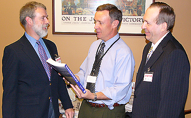 October 20, 2006 - NH Union Leader/Sunday News publisher Joe McQuaid gets the first copy of the new Manchester Airport book from co-authors Ed Brouder (l) and Moe Quirin (r)